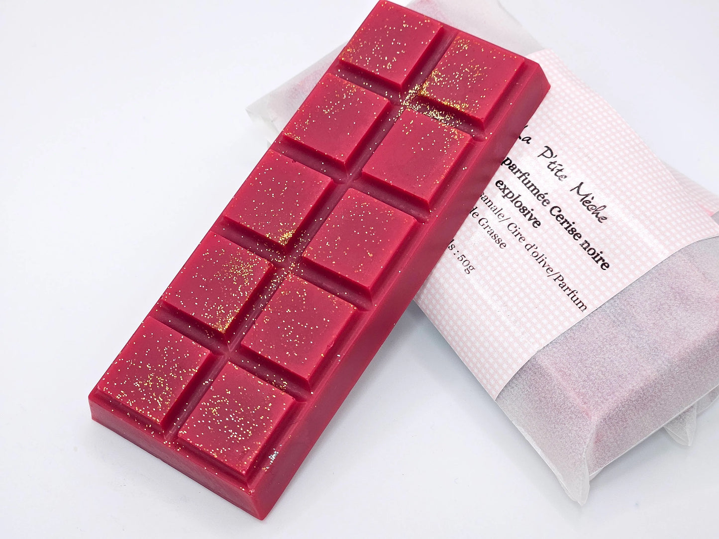 Fondant parfumé snapbar artisanal à la cerise noire explosive, couleur rouge intense avec paillettes